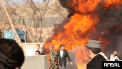 Former First Vice President Ahmad Zia Mas'ud (center) inspects the damage near his home in central Kabul.