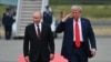 US President Donald Trump salutes as he walks with Russian President Vladimir Putin on the tarmac after they arrived at Joint Base Elmendorf-Richardson in Anchorage, Alaska, on August 15, 2025.