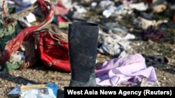 Passengers' belongings are pictured at the site where the Ukraine International Airlines plane crashed after take-off from Iran's Imam Khomeini airport, on the outskirts of Tehran, January 8, 2020