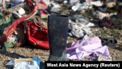 Passengers' belongings are pictured at the site where the Ukraine International Airlines plane crashed after take-off from Iran's Imam Khomeini airport, on the outskirts of Tehran, January 8, 2020