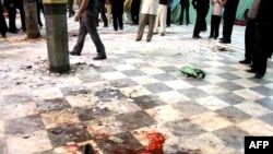 Blood stains the ground inside the Amir al-Momenin mosque in Zahedan.