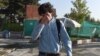 An Afghan refugee deported from Germany arrives at the international airport in Kabul on September 13.