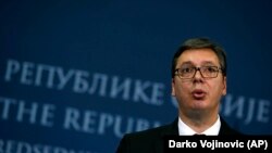 Serbian President Aleksandar Vucic speaks during a press conference after talks with Bosnia's three-member presidency in Belgrade on December 6.