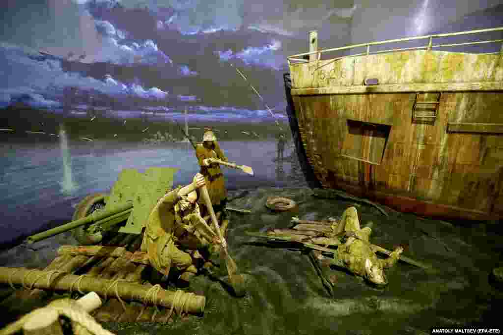 Red Army soldiers paddle artillery across a waterway. The exhibition will reportedly be the largest of its kind in the world.