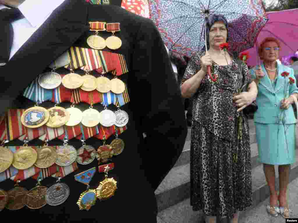 A veteran participates in celebrations of the 65th anniversary of the end of World War II in the far eastern city of Vladivostok on September 2. The holiday, marking the victory over Japan in World War II, is a new national memorial day in Russia. Photo by Yury Maltsev for Reuters