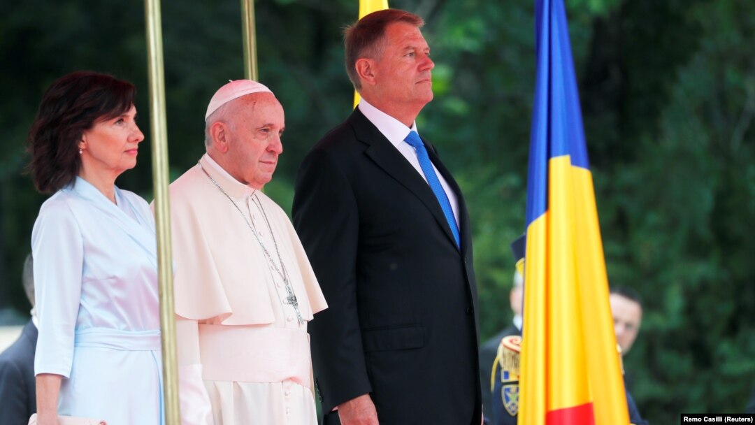 Pope Francis stands next to Romanian President Klaus Iohannis and his wife, Carmen, during a welcome ceremony at the Cotroceni Palace in Bucharest on May 31.