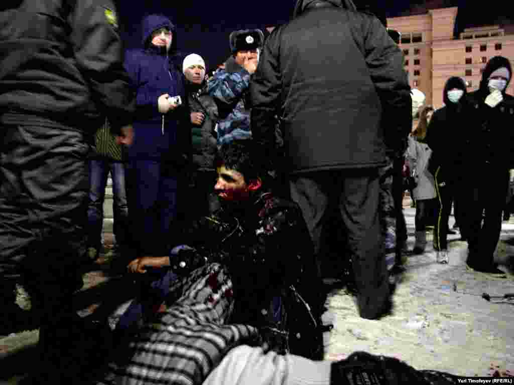 Men who appeared to come from the Caucasus were beaten up by protesting fans.