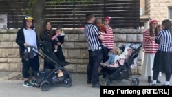 People celebrate the Jewish holiday of Purim in Jerusalem on March 4, amid intermittent air-raid warnings.