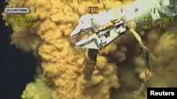 A robotic arm using a wrench during the "top kill" procedure to stop the flow of oil from the Gulf of Mexico oil well.