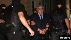Extreme-right Golden Dawn party leader Nikolaos Mihaloliakos was taken into custody in Athens on October 2.