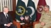 FILE: Pakistani Army Chief General Qamar Javed Bajwa (R) speaks with U.S. Defense Secretary Jim Mattis during a meeting in Rawalpindi, Pakistan on December 4, 2017.