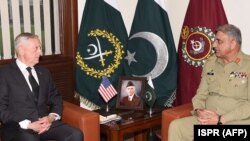 FILE: Pakistani Army Chief General Qamar Javed Bajwa (R) speaks with U.S. Defense Secretary Jim Mattis during a meeting in Rawalpindi, Pakistan on December 4, 2017.