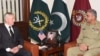 FILE: Pakistani Army Chief General Qamar Javed Bajwa (R) speaks with U.S. Defense Secretary Jim Mattis in December 2017.