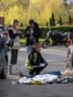 EDITORS NOTE: Graphic content / TOPSHOT - Police experts examine a body of a person shot by a gunman outside a supermarket in Kyiv on April 18, 2026.