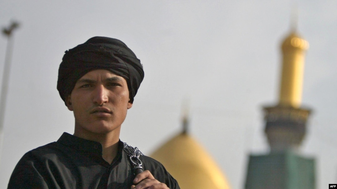 A Shi'ite Muslim in Iraq holds chains used in self-flagellation outside the Imam Hussein shrine during the Ashura observation in Karbala in December 2009.