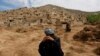 Survivors mourn for their relatives at the site of a landslide in Badakhshan province.