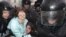 Russian riot police detain opposition activists during a rally in Moscow in March.