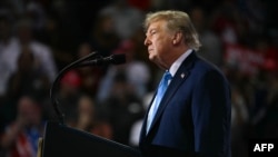 US President Donald Trump speaks at a midterm campaign rally at Truist Arena in Highland Heights, Kentucky on October 17, 2026.