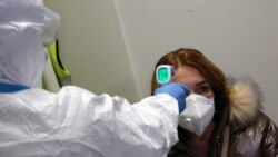 Измерение тепловым сканером температуры человека с подозрением на коронавирус