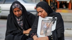 Women attend the funeral for victims of a strike on a school in Minab, Iran, on March 3.