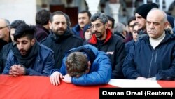 Relatives react at the funeral of one of the 39 people who died in an attack on an Istanbul nightclub early on New Year's Day. 
