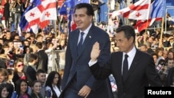 Georgian President Mikheil Saakashvili (left) and his French counterpart Nicolas Sarkozy on Freedom Square in Tbilisi. 