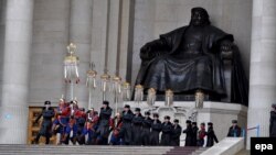 Soldiers march in front of a giant statue of Genghis Khan in Ulan Bator to mark his 850th birthday.