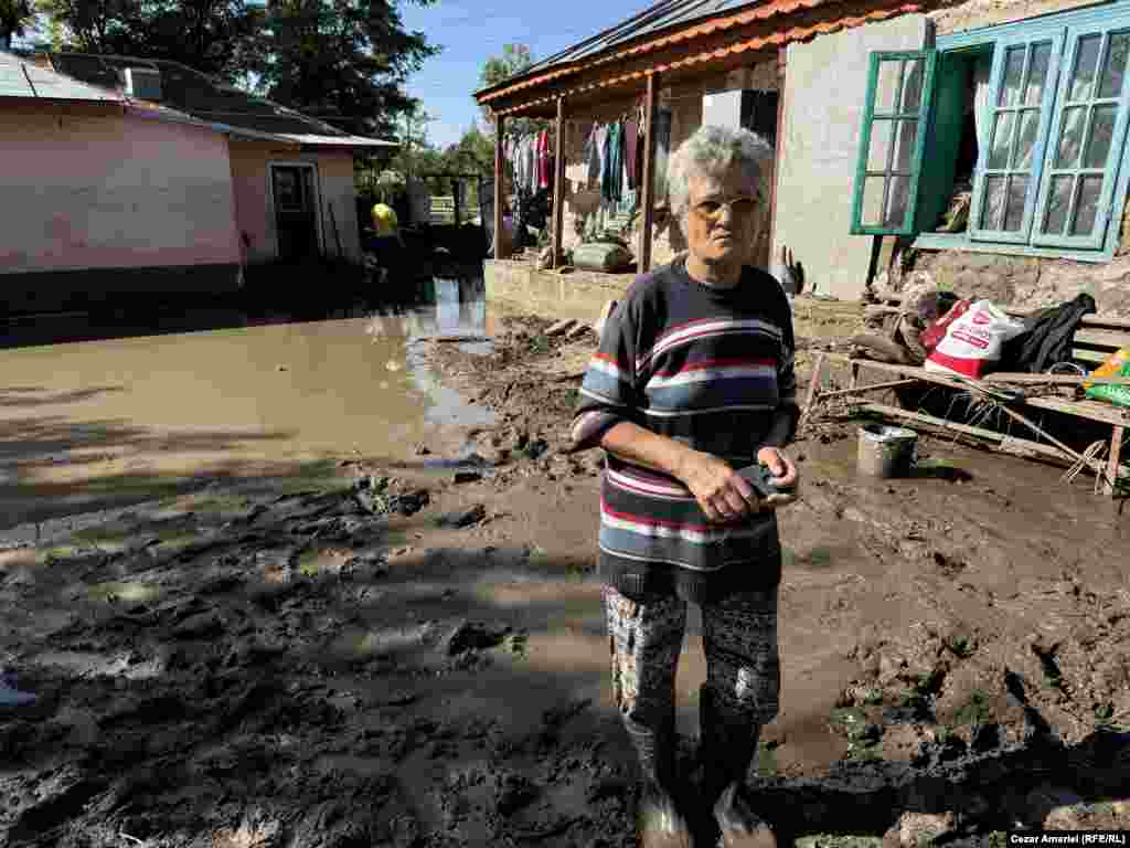 Stefana Bodea, 60, surveys the damage to her home in&nbsp;Slobozia Conachi. She survived the flooding by waiting it out in her attic.