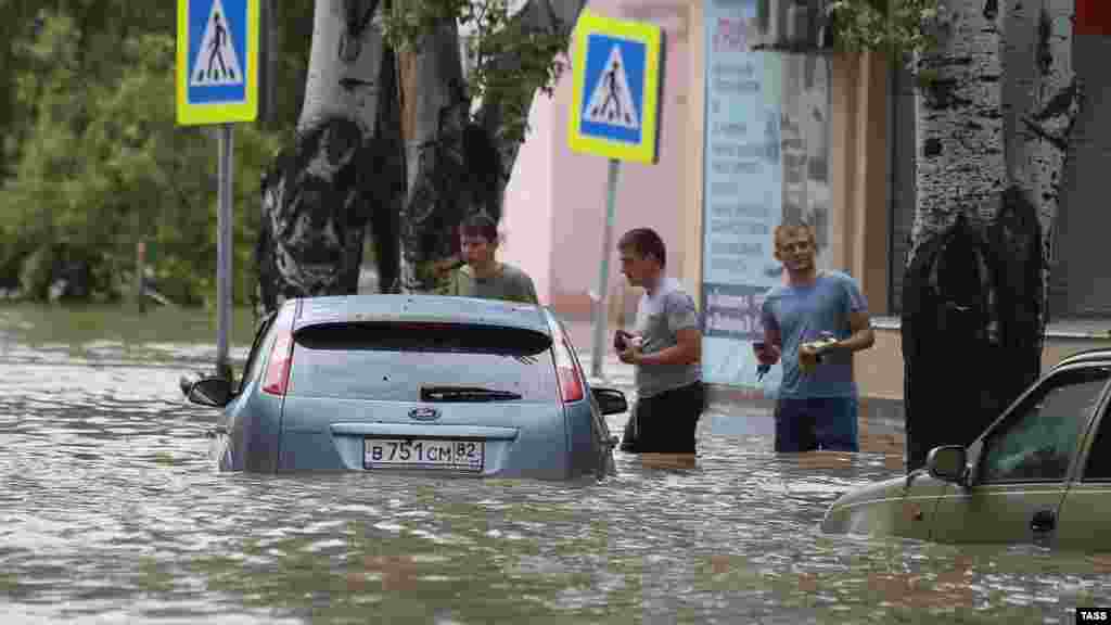 Many cars were damaged by the floodwaters.