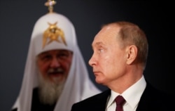 Vladimir Putin (right) and Patriarch Kirill in Moscow late last year.