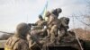 Ukrainian soldiers take up positions on the front line at an undisclosed location in the Donetsk region on November 24.