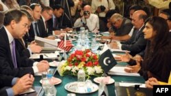 U.S. Deputy Secretary of State Tom Nides (left) speaks with Pakistani Foreign Minister Hina Rabbani Khar during a meeting in Islamabad on April 4.