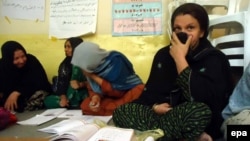 Women learn to read and write at at a vocational training institute run by the Afghan Women's Affairs Department in Kunduz.