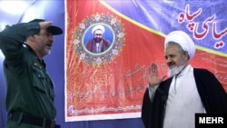 Cleric Ali Saidi (right), Supreme Leader Ayatollah Ali Khamenei’s representative to the IRGC