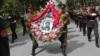 Soldiers carry wreaths and a portrait of Arsala Rahmani, a senior member of the High Peace Council who was assassinated by Afghan insurgents earlier this month.