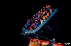 A boatload of Syrian refugees trying to make their way to Europe is intercepted by the Turkish Navy in 2015.