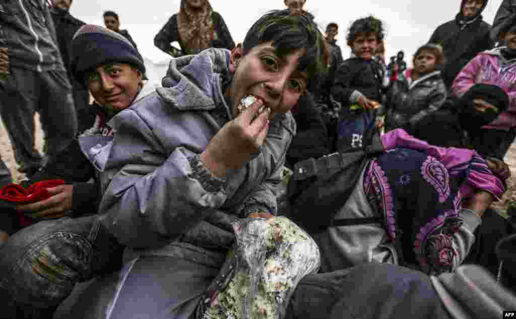 Syrian refugees are pictured in a camp near the Turkish border. Thousands of Syrians have been fleeing the embattled city of Aleppo, which has been the scene of heavy fighting in recent days. (AFP/Bulent Kilic)