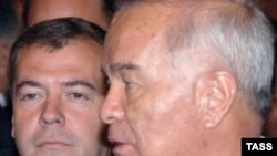 Looking over his shoulder? Uzbek President Islam Karimov (right) and Medvedev at a recent regional gathering