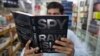 A customer in an Islamabad bookstore looks at Spy Chronicles, a new tell-all tome by former Indian and Pakistani intelligence chiefs that has caused a storm in both countries. 