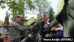 Serbian presidental candidate Tomislav Nikolic talks to reporters after voting in Belgrade on May 20.