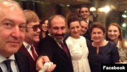 Armenia - Prime Minister Nikol Pashinian takes a selfie with Elton John and President Armen Sarkissian (L) after a dinner in Yerevan, 27 May 2018.