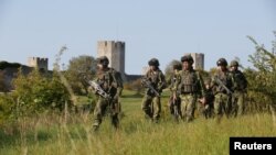 Swedish soldiers patrol outside Visby on the Baltic island of Gotland.