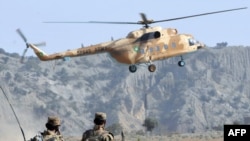 A Pakistani Army helicopter flies as soldiers patrol in Sararogha, South Waziristan (file photo).