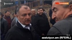 Armenia - Gagik Melikian of the ruling Republican Party promises cash to a voter in Tavush province, 18Mar2017.