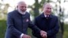 Russian President Vladimir Putin (right) and Indian Prime Minister Narendra Modi react while walking near the Constantine Palace during their meeting in St. Petersburg in June 2017.