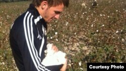 Uzbekistan - Pavel Smolyachenko, forward at football club "Neftchi", picking cotton in a field in Ferghana, October 7, 2013.