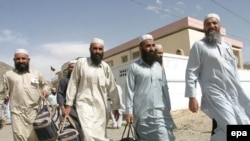  Afghan prisoners leave the U.S. detention center at Bagram Airfield in 2006.