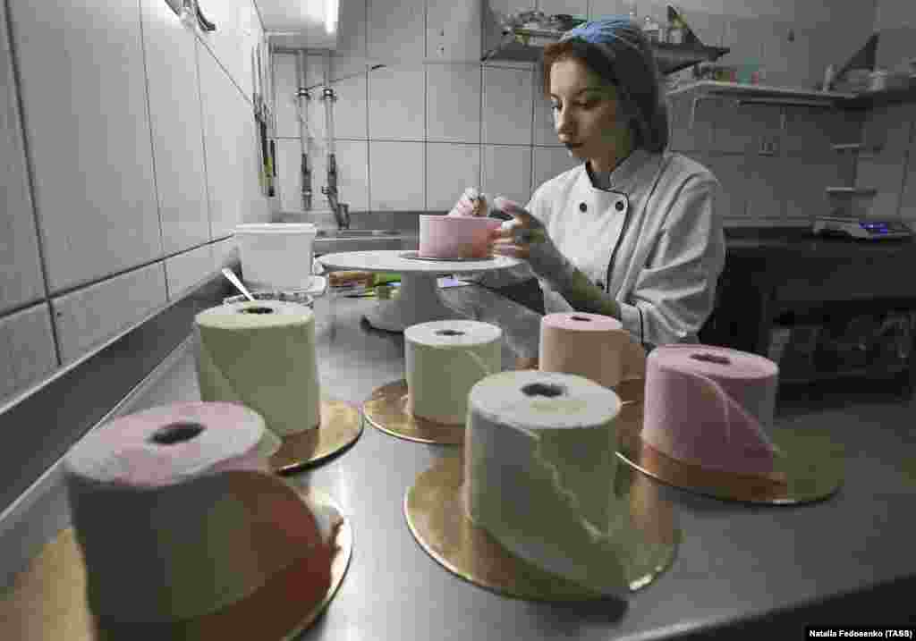 A pastry chef making desserts in the shape of toilet paper rolls in Minsk, Belarus, on April 1. As the coronavirus spread around the world, there were scenes of panic buying and toilet paper shortages in several shops.