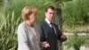 Russia - Russian President Dmitry Medvedev (R) and German Chancellor Angela Merkel (L) walk after their joint news conference in Bocharov Ruchei presidential residence in the Black sea resort of Sochi, 15Aug2008