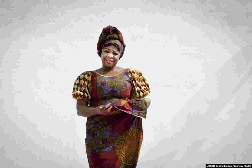 Mbela fled Kinshasha in the Democratic Republic of the Congo in 1997 with her husband, whose political views had put them in danger. The most important thing she brought with her was a traditional dress. "This dress reminds me of my mother, who said that a real African woman should know how to wear a traditional dress to promote our culture and values," Mbela said. She is now a TV presenter in Bucharest, Romania.